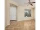 Living room with tile floors, a ceiling fan, and views to the entry and kitchen at 5219 W Buckskin Dr, Eloy, AZ 85131