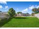 Spacious backyard featuring a grassy lawn and a swimming pool at 527 N Valencia Pl, Chandler, AZ 85226