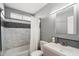 Clean bathroom featuring marble tile, updated vanity, and a bathtub at 527 N Valencia Pl, Chandler, AZ 85226