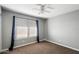 Simple bedroom with carpeted floors and a large window at 527 N Valencia Pl, Chandler, AZ 85226