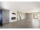 Bright living room with hardwood floors, fireplace, and sliding glass doors at 527 N Valencia Pl, Chandler, AZ 85226