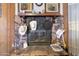 Stone fireplace with decorative hats and artwork at 535 S Alma School Rd # 113, Mesa, AZ 85210