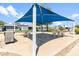 Relaxing outdoor patio area with shade structure and picnic tables at 535 S Alma School Rd # 113, Mesa, AZ 85210