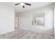 Bedroom with carpeted floor, ceiling fan and window coverings at 5590 W Victory Way, Florence, AZ 85132