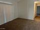 Neutral bedroom with carpeted floors and sliding glass door at 6550 N 47Th Ave # 286, Glendale, AZ 85301