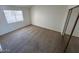 This bedroom has a window for natural light and carpeting throughout at 6550 N 47Th Ave # 286, Glendale, AZ 85301