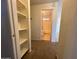 Hallway featuring built in shelving and bathroom entrance at 6550 N 47Th Ave # 286, Glendale, AZ 85301