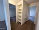 Hallway featuring built in shelving in the home's interior at 6550 N 47Th Ave # 286, Glendale, AZ 85301