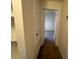 Hallway featuring built in shelving and bedroom entrance at 6550 N 47Th Ave # 286, Glendale, AZ 85301