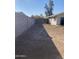 Large backyard with gravel and block wall at 702 W Grove Cir, Mesa, AZ 85210