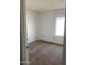 Simple bedroom with neutral carpet and large window at 702 W Grove Cir, Mesa, AZ 85210