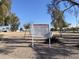 Sign indicating private park rules and hours at 702 W Grove Cir, Mesa, AZ 85210