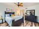 Bedroom with queen bed, dresser, and ceiling fan at 7313 E Pleasant E Run, Scottsdale, AZ 85258