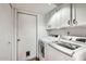 Bright laundry room with washer, dryer, and cabinets at 7313 E Pleasant E Run, Scottsdale, AZ 85258