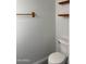 Simple bathroom with toilet and wood shelving at 7801 N 44Th Dr # 1183, Glendale, AZ 85301