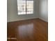 Spacious bedroom with large window and wood floors at 7801 N 44Th Dr # 1183, Glendale, AZ 85301