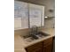 Clean kitchen with double sink, wood cabinets, and stainless steel appliances at 7801 N 44Th Dr # 1183, Glendale, AZ 85301