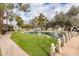 Community pond with lush landscaping and walkway at 8300 E Via De Ventura Rd # 2006, Scottsdale, AZ 85258