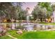 Serene community pond with fountain and lush greenery at 8300 E Via De Ventura Rd # 2006, Scottsdale, AZ 85258