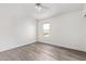 Bright bedroom with wood-look floors and a ceiling fan at 9144 E Pershing Ave, Scottsdale, AZ 85260