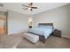 Main bedroom with a double bed and access to en-suite bathroom at 9184 W Donald Dr, Peoria, AZ 85383