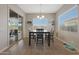 Bright breakfast nook with table and chairs, sliding door to backyard at 9184 W Donald Dr, Peoria, AZ 85383