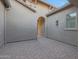 Brick paved courtyard with arched walkway and exterior lighting at 9184 W Donald Dr, Peoria, AZ 85383