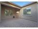 Courtyard entry with brick pavers and a wood door at 9184 W Donald Dr, Peoria, AZ 85383