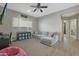 Bright and airy Gathering room featuring a comfortable sectional sofa and large TV at 9184 W Donald Dr, Peoria, AZ 85383