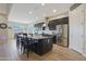 Spacious kitchen featuring an island with seating, stainless steel appliances, and granite countertops at 9184 W Donald Dr, Peoria, AZ 85383