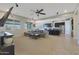 Open concept living room with a view of the kitchen and plenty of natural light at 9184 W Donald Dr, Peoria, AZ 85383