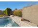 Waterfall detail of a modern pool and stonework at 9184 W Donald Dr, Peoria, AZ 85383