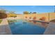 Clean rectangular pool with surrounding landscaping at 9184 W Donald Dr, Peoria, AZ 85383