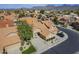 Stunning aerial view of a home with a tile roof, beautiful landscaping, and mountain views at 9288 E Camino Del Santo --, Scottsdale, AZ 85260