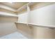 Walk-in closet with shelving and hanging rods for optimal storage and organization at 9288 E Camino Del Santo --, Scottsdale, AZ 85260