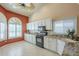 Bright kitchen features white cabinets, granite countertops, and modern appliances at 9288 E Camino Del Santo --, Scottsdale, AZ 85260