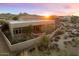 Aerial view of a home with desert landscaping and mountain views at 10874 E Dale Ln, Scottsdale, AZ 85262