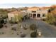 Aerial view showcasing a home's exterior, landscaping, and driveway at 10874 E Dale Ln, Scottsdale, AZ 85262