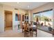 Bright breakfast nook with patio access and wood table at 10874 E Dale Ln, Scottsdale, AZ 85262