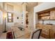 Elegant dining room featuring a rustic wood table at 10874 E Dale Ln, Scottsdale, AZ 85262