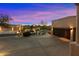 View of the home's garage and surrounding landscape at 10874 E Dale Ln, Scottsdale, AZ 85262