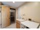 Laundry room with wine cooler and utility sink at 10874 E Dale Ln, Scottsdale, AZ 85262