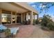 Relaxing patio with seating area and access to the interior of the home at 10874 E Dale Ln, Scottsdale, AZ 85262