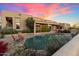 Home exterior with inviting pool and sunset views at 10874 E Dale Ln, Scottsdale, AZ 85262