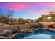 Stunning pool area with mountain views at sunset at 10874 E Dale Ln, Scottsdale, AZ 85262