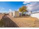 Large backyard with a shed, mature tree and partial view of home at 10951 N 91St Ave # 56, Peoria, AZ 85345