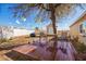 Wooden deck with patio furniture and a shed in the backyard at 10951 N 91St Ave # 56, Peoria, AZ 85345