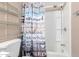 Bathroom with a shower/tub combo and a decorative shower curtain at 10951 N 91St Ave # 56, Peoria, AZ 85345