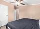 Bedroom with a ceiling fan, and large closet at 10951 N 91St Ave # 56, Peoria, AZ 85345