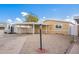 Tan single-wide mobile home with carport and landscaped yard at 10951 N 91St Ave # 56, Peoria, AZ 85345